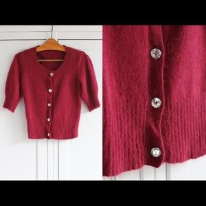 Angora puff sleeve cardigan with assorted jewel buttons.